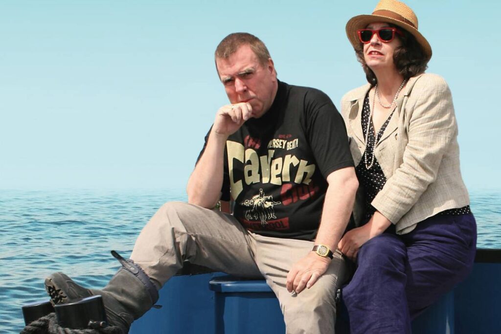 shane spall - timothy spall wife, both sitting in a boat together